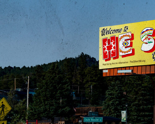 Artistic billboard framed by Black Hills landscape
