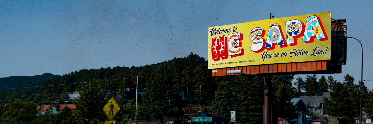 Artistic billboard framed by Black Hills landscape